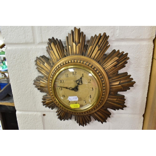 432 - TWO SMITHS SUNBURST WALL CLOCKS, comprising one with double sunburst and silvered dial, key included... 