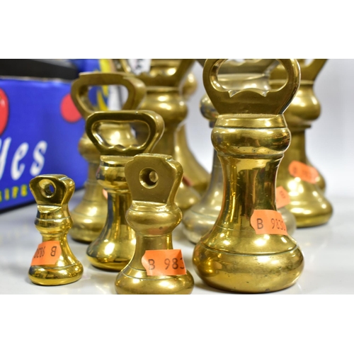 443 - TEN BRASS BELL WEIGHTS, from different sets, comprising 7lb (x2), 4lb (x3), 2lb (x2), 1lb, 8oz and 4... 