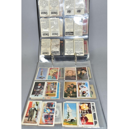 445 - A BOX OF CIGARETTE AND TRADING CARDS, mostly football related, two partially filled 1970s football s... 