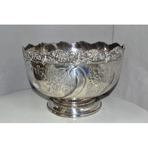 446 - A GROUP OF SILVER PLATED ITEMS, to include a pair of cut glass plated claret jugs, a large punch bow... 