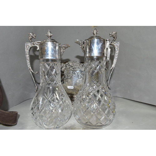 446 - A GROUP OF SILVER PLATED ITEMS, to include a pair of cut glass plated claret jugs, a large punch bow... 