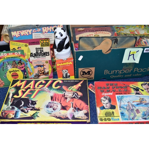 493 - THREE BOXES OF VINTAGE TOYS AND GAMES, to include a boxed Pelham Puppet Witch, in distressed box and... 