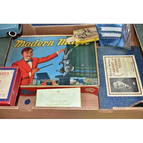 493 - THREE BOXES OF VINTAGE TOYS AND GAMES, to include a boxed Pelham Puppet Witch, in distressed box and... 