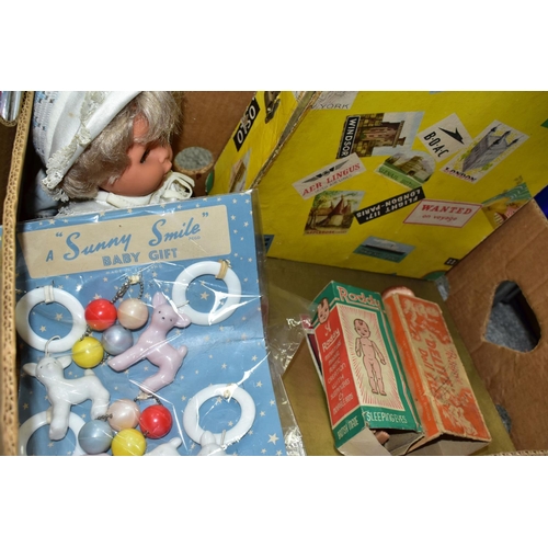 504 - THREE BOXES OF VINTAGE DOLL INTEREST ITEMS, including a 1960s Roddy doll in a yellow card suitcase s... 