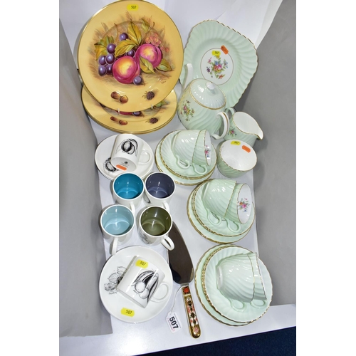 507 - THREE AYNSLEY FRUIT DESIGN DINNER PLATES, WEDGWOOD SUSIE COOPER DESIGN COFFEE WARES, A PALE GREEN AN... 