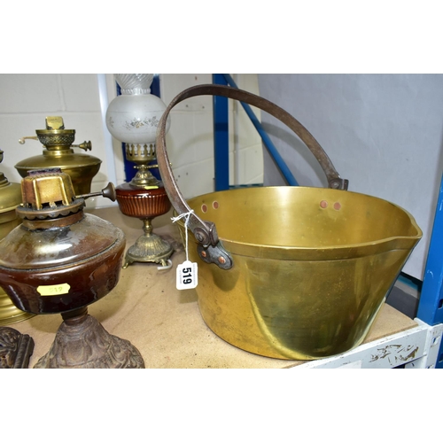 519 - A GROUP OF OIL LAMP BASES, ELECTRIC TABLE LAMP AND BRASS JAM PAN, comprising two brass oil lamp base... 