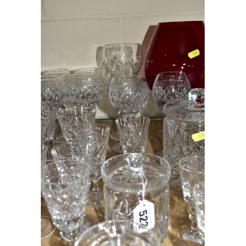 522 - A QUANTITY OF CUT CRYSTAL AND COLOURED GLASS, comprising a set of eleven long stemmed wine glasses, ... 