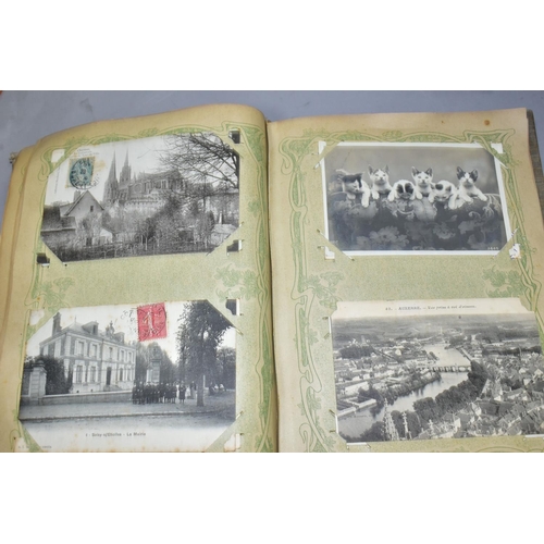 576 - A BOX OF BOOKS AND POSTCARDS, two albums containing approximately 400 early 20th century postcards, ... 