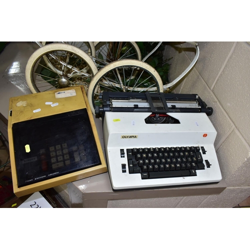 597 - A DOLL'S SILVER CROSS PRAM, ELECTRONIC TYPEWRITER AND VINTAGE CALCULATOR, comprising a coach built d... 