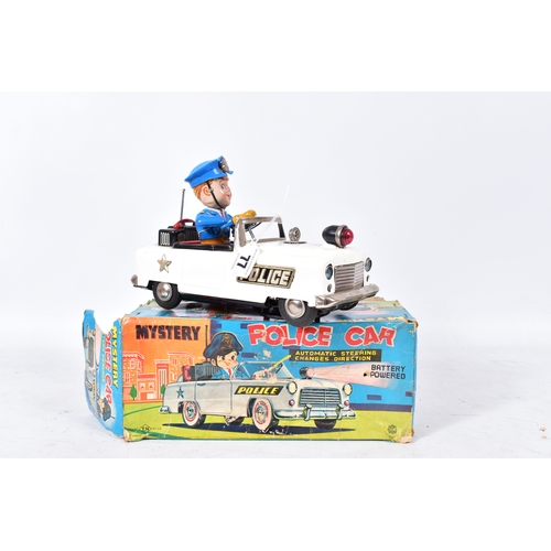 77 - A BOXED NOMURA (TN TOYS) TINPLATE BATTERY OPERATED  MYSTERY POLICE CAR, not tested, appears largely ... 