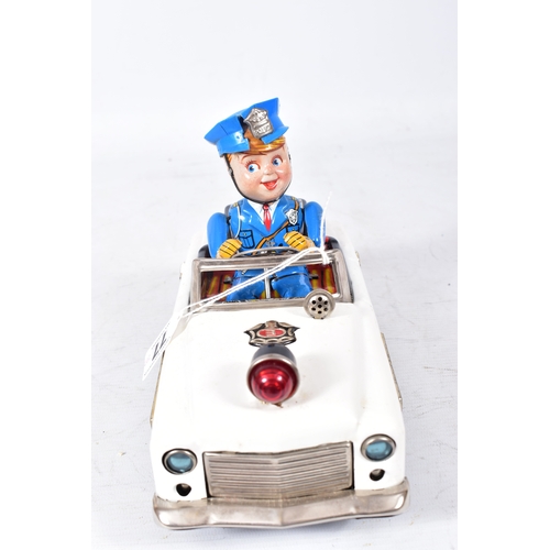 77 - A BOXED NOMURA (TN TOYS) TINPLATE BATTERY OPERATED  MYSTERY POLICE CAR, not tested, appears largely ... 