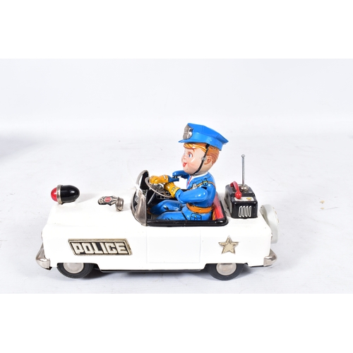 77 - A BOXED NOMURA (TN TOYS) TINPLATE BATTERY OPERATED  MYSTERY POLICE CAR, not tested, appears largely ... 