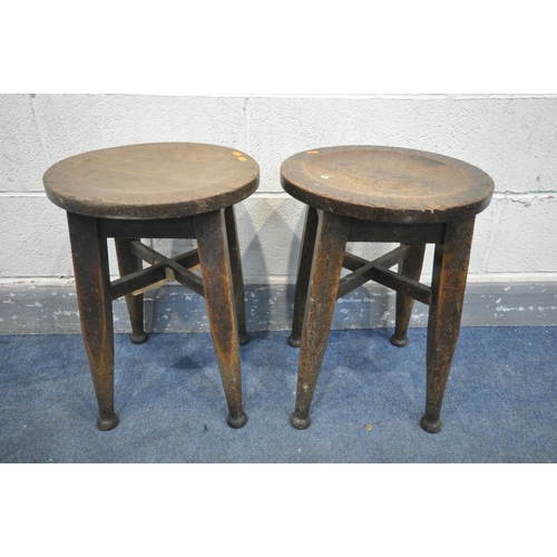 1333 - A PAIR OF 19TH CENTURY OAK CIRCULAR STOOLS, on four tapered legs, and padded feet united by cross st... 