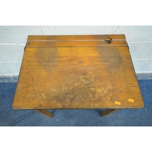 1335 - A PAIR OF 20TH CENTURY OAK SINGLE SCHOOL DESKS, with an metal banded open top lid, ink well section,... 