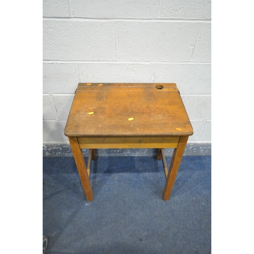 1335 - A PAIR OF 20TH CENTURY OAK SINGLE SCHOOL DESKS, with an metal banded open top lid, ink well section,... 