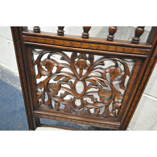 1493 - A PAIR OF HARDWOOD ORIENTAL CHAIRS, of very low proportions, with carved foliate detailing to back, ... 