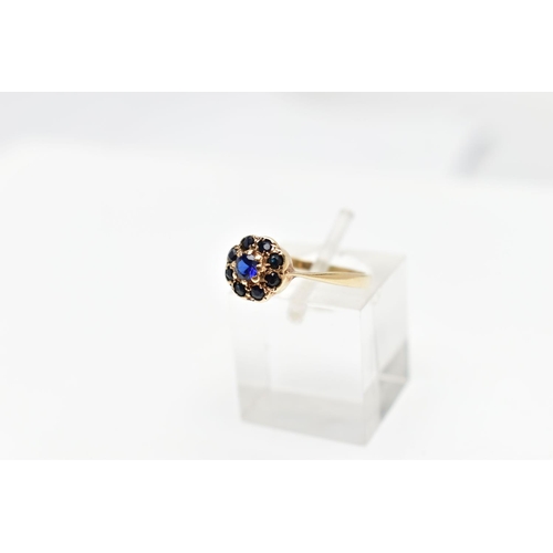 111 - A 9CT GOLD SAPPHIRE CLUSTER RING, the circular cut central sapphire with similar cut sapphire surrou... 