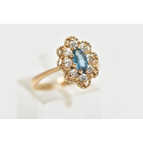 189 - A 9CT GEM SET RING, the ring of a lozenge shape, set with a central marquise cut light blue syntheti... 