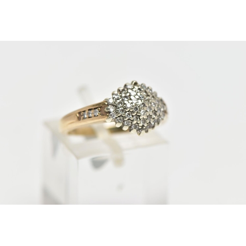 193 - A 9CT GOLD DIAMOND CLUSTER RING, of a marquise form set with single cut diamonds, single cut diamond... 