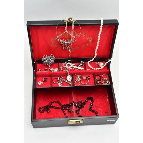 194 - A BLACK JEWELLERY BOX WITH CONTENTS, hinged black jewellery box with a red fabric interior, together... 