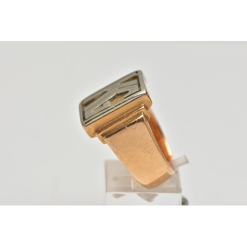 32 - A HEAVY YELLOW METAL SIGNET RING, of a rectangular form displaying the initials 'KG', stepped should... 