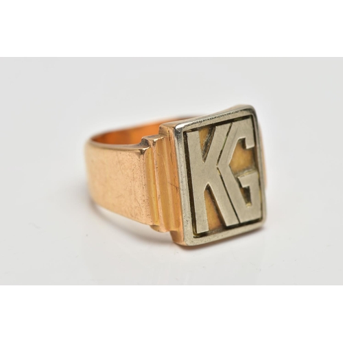 32 - A HEAVY YELLOW METAL SIGNET RING, of a rectangular form displaying the initials 'KG', stepped should... 