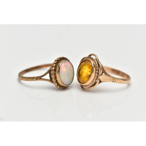 44 - TWO YELLOW METAL RINGS, to include a 9ct gold opal single stone ring set with an oval opal cabochon ... 