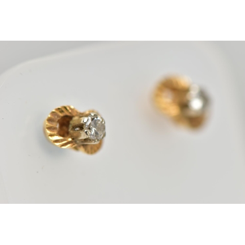 47 - A PAIR OF DIAMOND EARRINGS, a pair of yellow metal stud earrings, each earring prong set with a sing... 