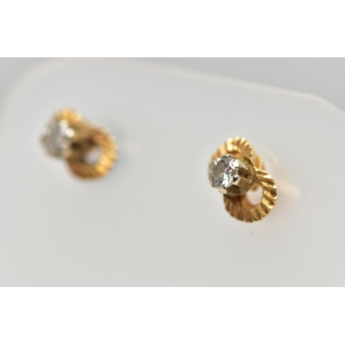 47 - A PAIR OF DIAMOND EARRINGS, a pair of yellow metal stud earrings, each earring prong set with a sing... 