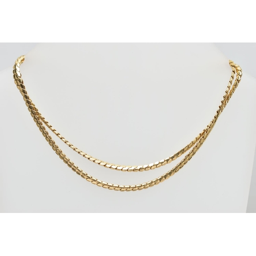 52 - A YELLOW METAL NECKLACE, snake link chain, stamped 14k, approximate width of chain 3.3mm, length 670... 