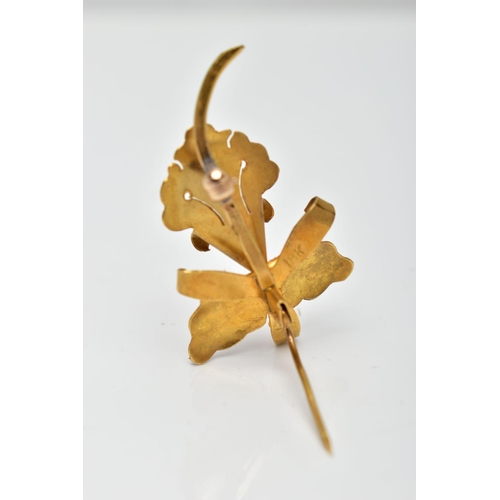 62 - A YELLOW METAL FLOWER BROOCH, a floral brooch detailing a flower, leaves and stem, set with a single... 