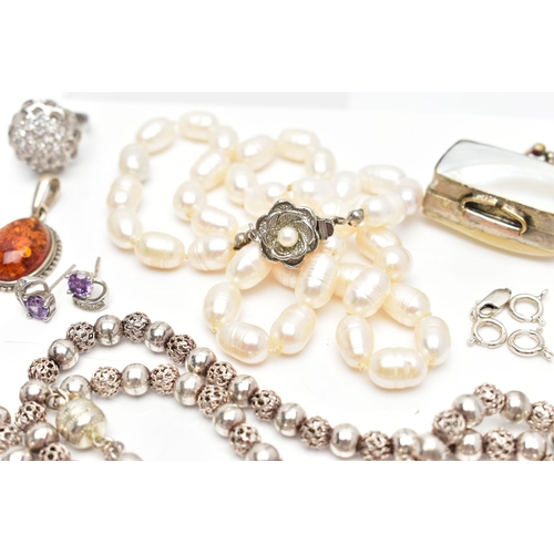 65 - A SELECTION OF SILVER AND WHITE METAL JEWELLERY, to include an early 20th century silver circular tr... 