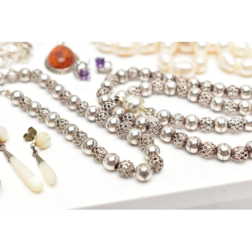 65 - A SELECTION OF SILVER AND WHITE METAL JEWELLERY, to include an early 20th century silver circular tr... 