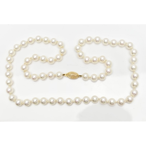 74 - A CASED IMITATION PEARL NECKLACE, a single row of white imitation pearl beads individually knotted o... 