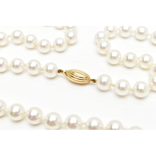 74 - A CASED IMITATION PEARL NECKLACE, a single row of white imitation pearl beads individually knotted o... 