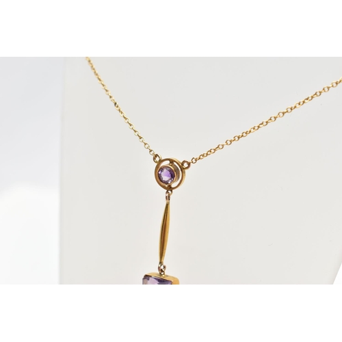 77 - A YELLOW METAL AMETHYST DROP PENDANT, WITH TRACE LINK CHAIN, the square cut amethyst collet set, to ... 