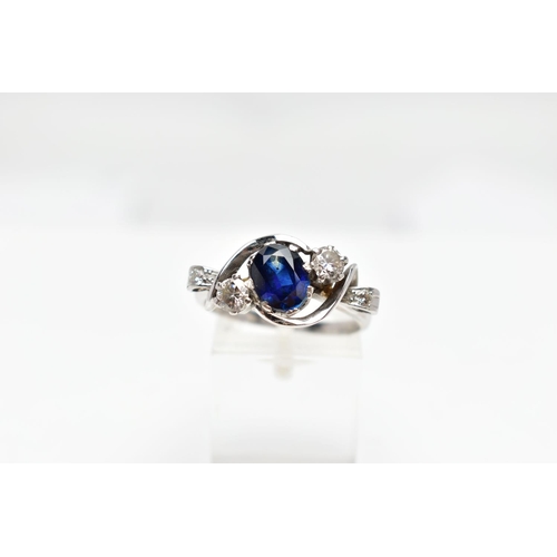 87 - AN 18CT WHITE GOLD SAPPHIRE AND DIAMOND DRESS RING, the oval shape sapphire measuring approximately ... 