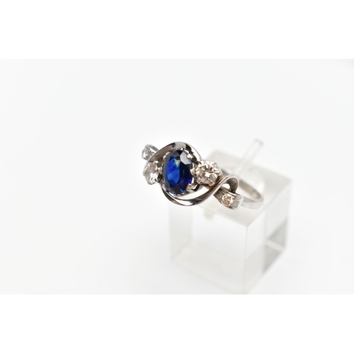 87 - AN 18CT WHITE GOLD SAPPHIRE AND DIAMOND DRESS RING, the oval shape sapphire measuring approximately ... 