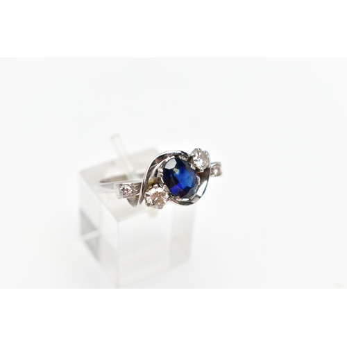 87 - AN 18CT WHITE GOLD SAPPHIRE AND DIAMOND DRESS RING, the oval shape sapphire measuring approximately ... 