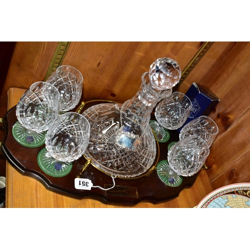 351 - A STUART CRYSTAL SHIPS DECANTER AND SIX BOXED BRANDY GLASSES, in Shaftesbury pattern, on a wooden pr... 