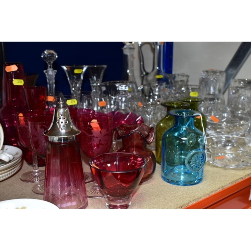 378 - A COLLECTION OF COLOURED AND CLEAR GLASSWARE, including a pair of carafe and glass sets engraved wit... 