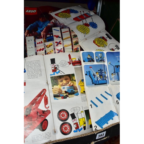 393 - A BOX OF VINTAGE LEGO AND RELATED BOOKLETS AND INSTRUCTION SHEETS, includes cogs, wheels, rubber tra... 