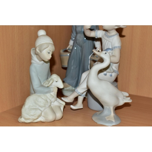 335 - THREE LLADRO FIGURINES AND A LLADRO DUCK FIGURE, comprising Boy with Pails 4811, issued in 1972, ret... 