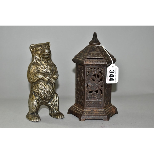 344 - TWO LATE 19TH/EARLY 20TH CENTURY METAL MONEY BOXES / BANKS, comprising a cast iron hexagonal post bo... 