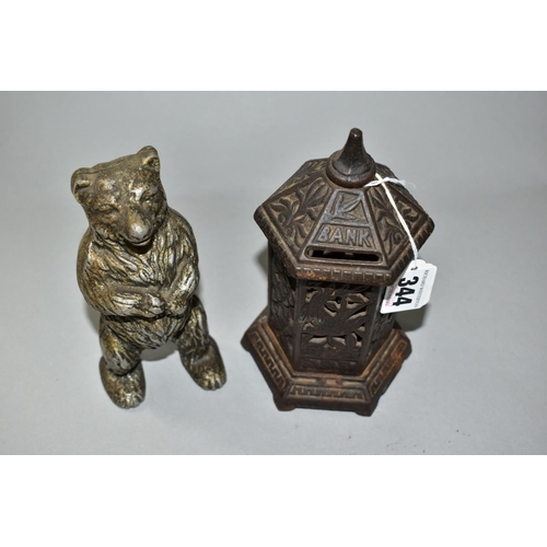 344 - TWO LATE 19TH/EARLY 20TH CENTURY METAL MONEY BOXES / BANKS, comprising a cast iron hexagonal post bo... 