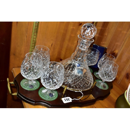 351 - A STUART CRYSTAL SHIPS DECANTER AND SIX BOXED BRANDY GLASSES, in Shaftesbury pattern, on a wooden pr... 