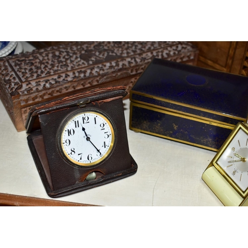 360 - A GROUP OF CLOCKS AND VARIOUS BOXES, to include a Le-Coultre 8-day travel alarm clock in cream ename... 