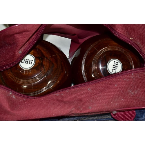 369 - A SET OF FOUR THURSTON LIGNUM VITAE CROWN GREEN BOWLS, together with a Drakes Pride standard Crown G... 