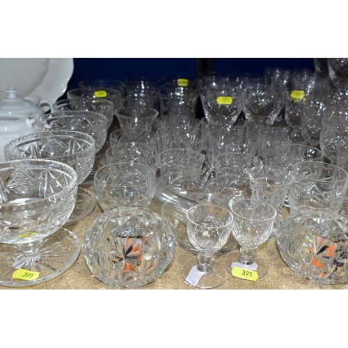 391 - A QUANTITY OF ASSORTED CUT GLASS DRINKING GLASSES, JUGS, GRAPEFRUIT DISHES, ETC, including pickle ja... 