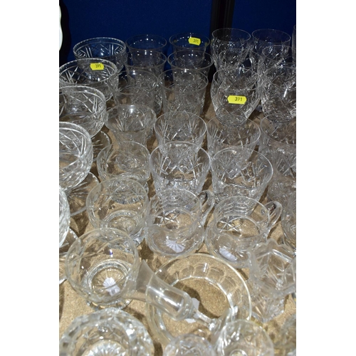 391 - A QUANTITY OF ASSORTED CUT GLASS DRINKING GLASSES, JUGS, GRAPEFRUIT DISHES, ETC, including pickle ja... 